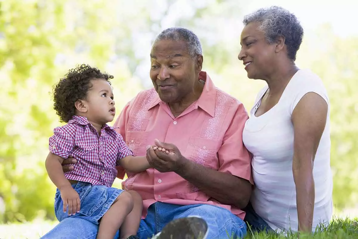Photo of Grandparents with grandson in park