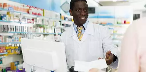 Photo of man at a pharmacy counter