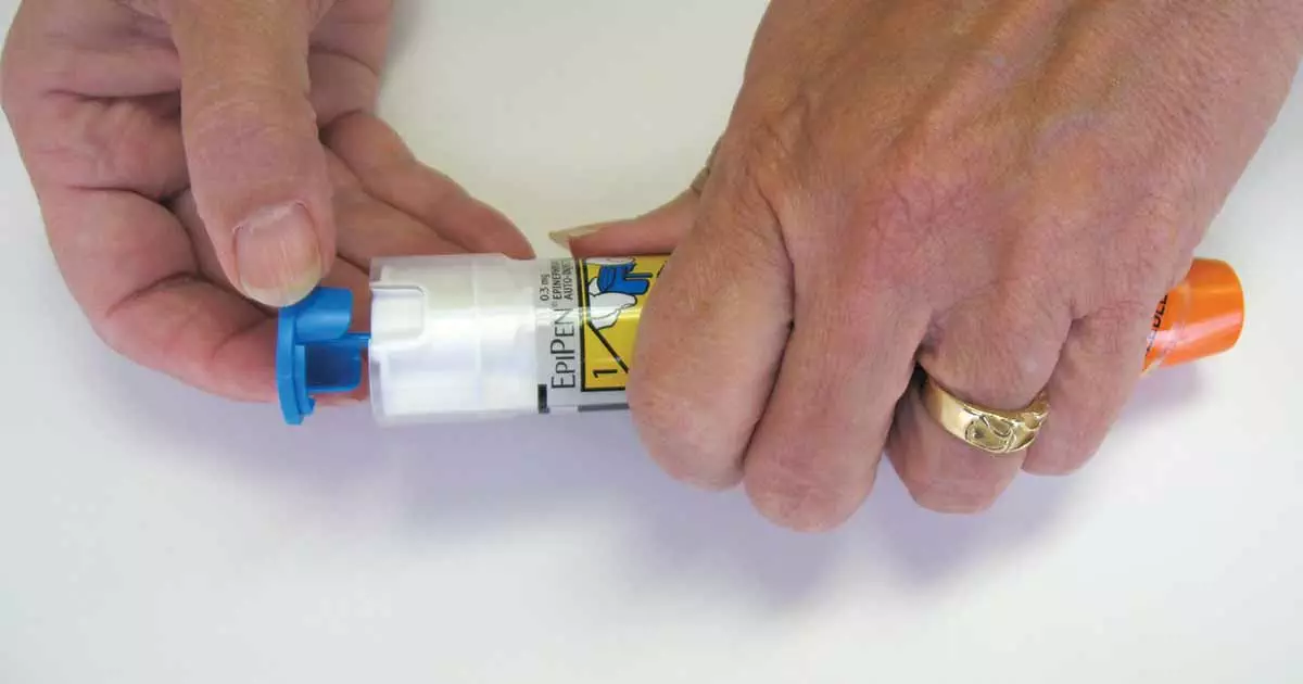 Woman opening auto-injector case