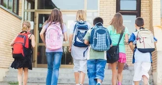 Photo of Children headed into school