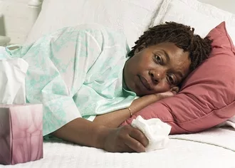 photo of Woman bed with the flu
