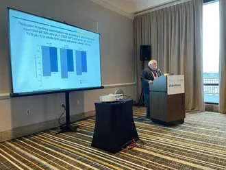 Photo of Chipps speaking at the 2021 USA Asthma Summit in New Orleans
