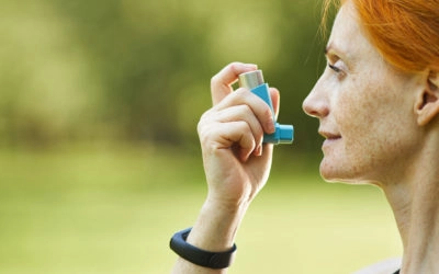 Asthma & Allergy Network Woman with asthma inhaler Summer Asthma and Warm Weather